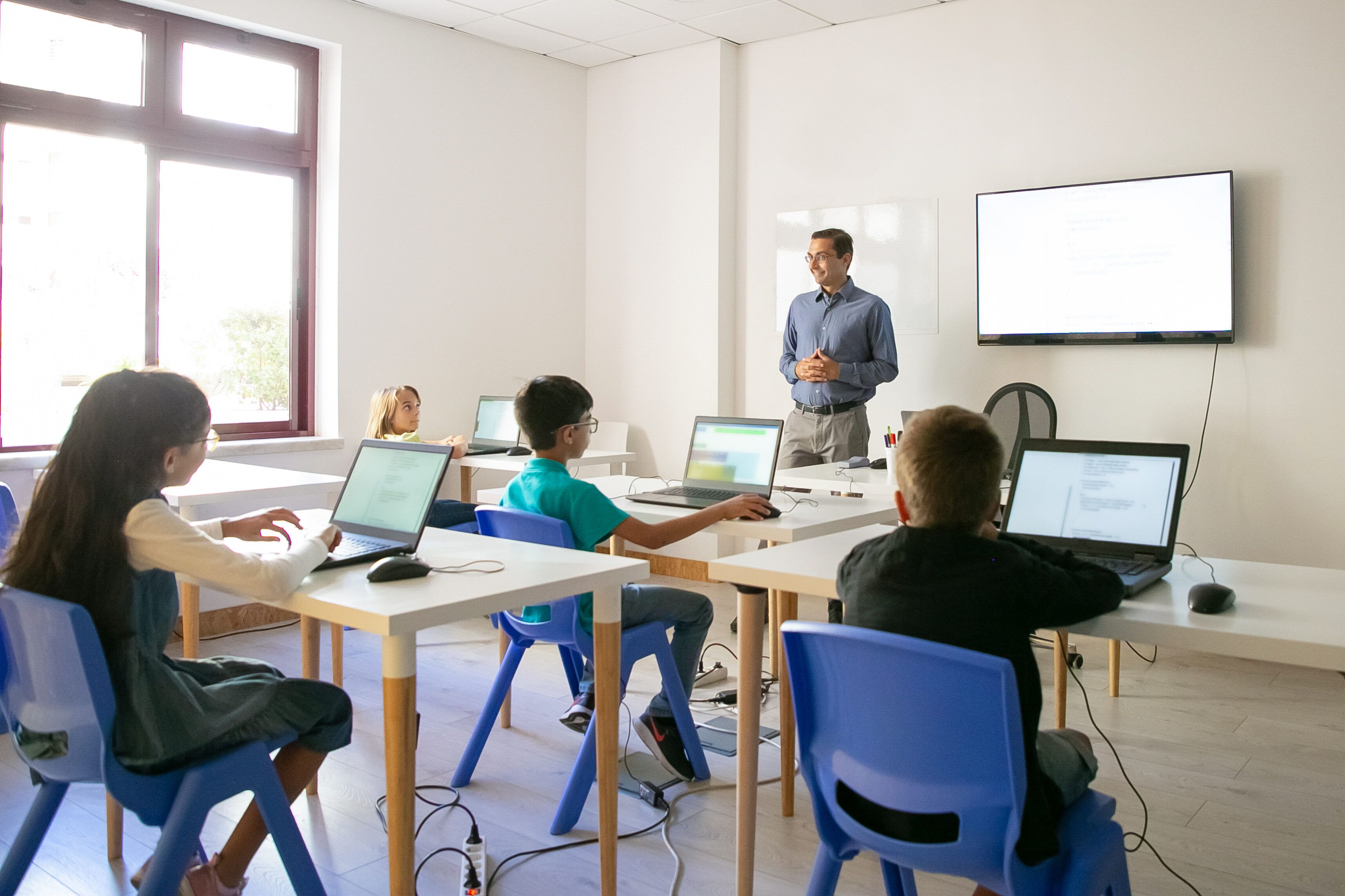 confident-teacher-explaining-lesson-pupils.jpg