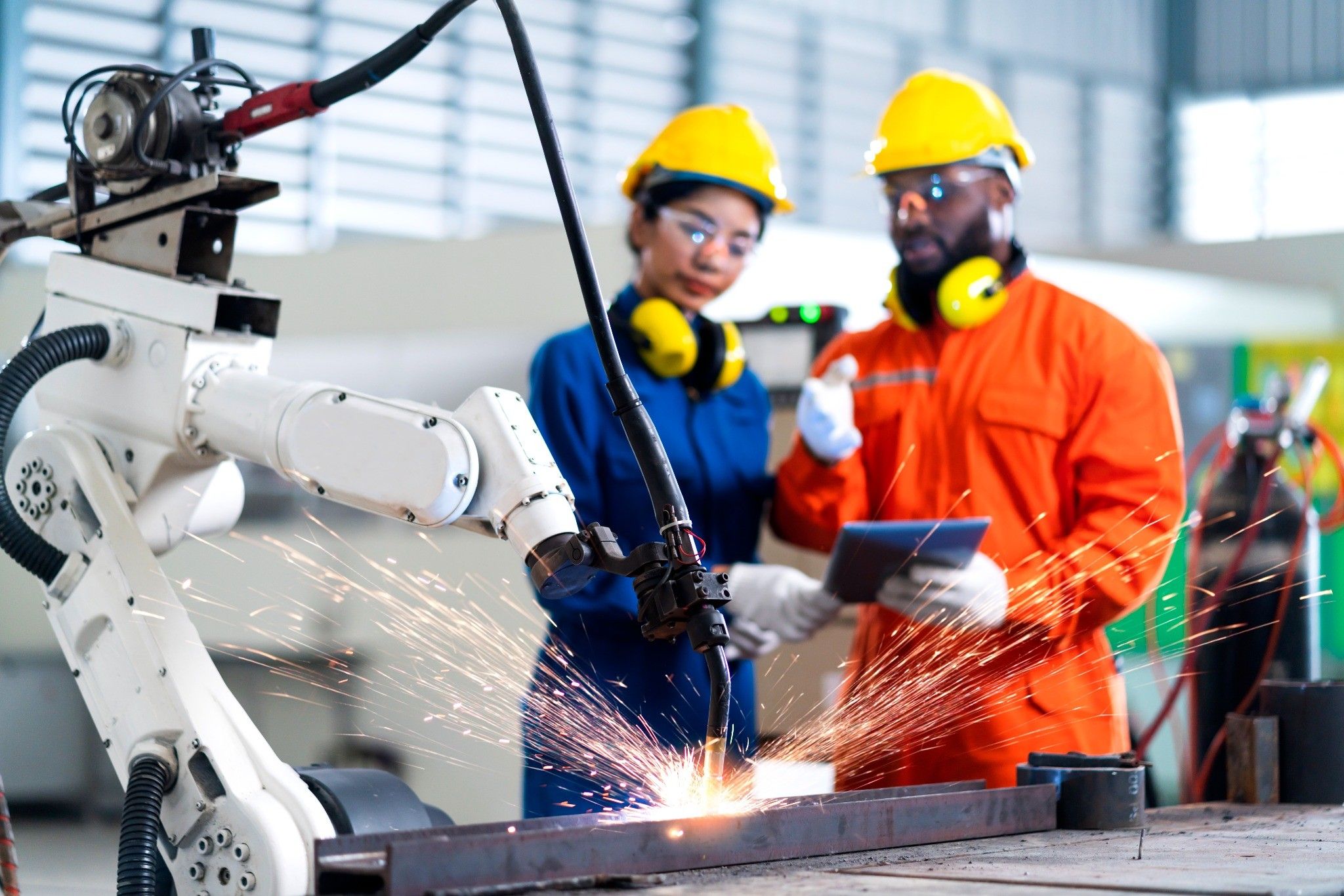 engineer-cooperation-male-female-technician-maintenance-control-relay-robot-arm-system-welding-with-tablet-laptop-control-quality-operate-process-work-heavy-industry-40-manufacturing-factory_under1MB.jpg